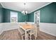 Bright dining area showcasing modern decor, a table setting and neutral tones at 214 Thumper Way, Clayton, NC 27520