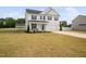 A well-maintained two-story home with classic architectural features and a spacious yard at 214 Thumper Way, Clayton, NC 27520