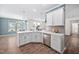Well-equipped kitchen with stainless steel dishwasher, modern countertop, and bright lighting at 214 Thumper Way, Clayton, NC 27520