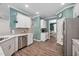 Bright kitchen with modern fixtures, stainless steel appliances, and adjacent dining area at 214 Thumper Way, Clayton, NC 27520