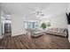 Open concept living room showcases hardwood floors, neutral paint, and access to the kitchen at 214 Thumper Way, Clayton, NC 27520