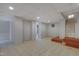 Basement featuring tile flooring, recessed lighting, support columns, and access to upper levels via staircase at 2157 Dunn Rd, Raleigh, NC 27614