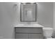 Clean bathroom with a modern vanity, toilet, and framed mirror at 2157 Dunn Rd, Raleigh, NC 27614