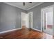 Spacious bedroom with a ceiling fan, hardwood floors, and multiple closets at 2157 Dunn Rd, Raleigh, NC 27614