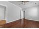 Bedroom featuring hardwood floors, ceiling fan, and multiple entry points at 2157 Dunn Rd, Raleigh, NC 27614