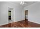 Bedroom boasting hardwood floors, ceiling fan and view to another room at 2157 Dunn Rd, Raleigh, NC 27614