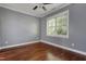 Cozy bedroom with a ceiling fan and a window offering pleasant views at 2157 Dunn Rd, Raleigh, NC 27614
