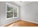 Bright bedroom with a large window providing natural light and cork flooring at 2157 Dunn Rd, Raleigh, NC 27614