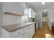 Bright kitchen featuring granite countertops, stainless steel appliances, and subway tile backsplash at 2157 Dunn Rd, Raleigh, NC 27614