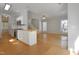 Open-concept kitchen with stainless steel appliances, a center island, and hardwood floors at 2157 Dunn Rd, Raleigh, NC 27614