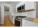 Well-equipped kitchen with a stainless steel oven and microwave, and granite countertops at 2157 Dunn Rd, Raleigh, NC 27614