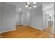 Spacious living area boasting hardwood floors, recessed lights, and access to the kitchen at 2157 Dunn Rd, Raleigh, NC 27614