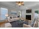 Staged living room featuring a fireplace, modern furniture, and hardwood floors at 2157 Dunn Rd, Raleigh, NC 27614