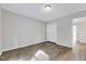 Bedroom featuring hardwood floors, neutral paint, and a closet at 217 Carolina Town Ln, Holly Springs, NC 27540