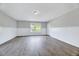 Bright bedroom with natural light from the windows and clean, white trim at 217 Carolina Town Ln, Holly Springs, NC 27540