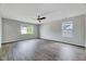 Bedroom featuring hardwood floors, natural light, and a ceiling fan at 217 Carolina Town Ln, Holly Springs, NC 27540