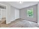 Cozy bedroom featuring a closet and a window, offering a comfortable and organized space at 217 Carolina Town Ln, Holly Springs, NC 27540