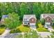 Beautiful home featuring a lush green lawn, a brick front, and a two-car garage at 217 Carolina Town Ln, Holly Springs, NC 27540