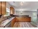Spacious kitchen boasts granite counters, a stainless sink, and abundant cabinet space at 217 Carolina Town Ln, Holly Springs, NC 27540