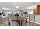 Open concept living space with a round dining table and a view of the modern kitchen at 217 Carolina Town Ln, Holly Springs, NC 27540