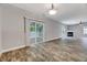 Expansive living room with sliding glass doors that open to an enclosed outdoor space at 217 Carolina Town Ln, Holly Springs, NC 27540