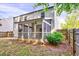 Home with a screened porch providing views of the fenced-in backyard, blending indoor and outdoor living at 217 Carolina Town Ln, Holly Springs, NC 27540