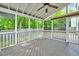 Relaxing screened porch with an airy design, wood floor offering a peaceful outdoor living space at 217 Carolina Town Ln, Holly Springs, NC 27540