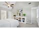 Spacious bedroom with carpeted floors and a white built-in shelving unit at 2205 Long And Winding Rd, Raleigh, NC 27603