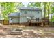 Exterior view of the home with a deck, a fire pit, and a fenced-in backyard at 2205 Long And Winding Rd, Raleigh, NC 27603