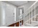 Home entryway with a white front door and staircase at 2205 Long And Winding Rd, Raleigh, NC 27603