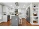 Bright kitchen featuring white cabinetry, stainless steel appliances, and an island with seating at 2205 Long And Winding Rd, Raleigh, NC 27603