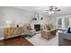 Living room featuring a fireplace, hardwood floors, and a neutral color palette at 2205 Long And Winding Rd, Raleigh, NC 27603