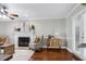View of the living room showcasing a fireplace and french doors to the outside at 2205 Long And Winding Rd, Raleigh, NC 27603
