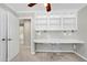 Office space with built in shelving, desk and an open view to the ensuite bathroom at 2205 Long And Winding Rd, Raleigh, NC 27603