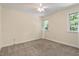 Bedroom featuring a neutral color scheme, a ceiling fan, and a window offering natural light at 224 Heidinger Dr, Cary, NC 27511