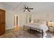 Comfortable bedroom featuring a ceiling fan, neutral walls, and a large window for natural light at 224 Heidinger Dr, Cary, NC 27511