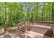 Multi-level wooden deck offering ample space and views of the surrounding trees at 224 Heidinger Dr, Cary, NC 27511