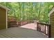 Spacious wooden deck surrounded by lush greenery, perfect for outdoor relaxation and entertaining at 224 Heidinger Dr, Cary, NC 27511