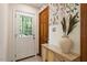 Welcoming entryway featuring colorful wallpaper and stylish decorative elements, adding charm to the home at 224 Heidinger Dr, Cary, NC 27511