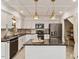 Modern kitchen boasts stainless steel appliances, a large island, and elegant pendant lighting at 224 Heidinger Dr, Cary, NC 27511