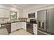 Well-equipped kitchen with stainless steel appliances, white cabinetry, and a stylish, functional layout at 224 Heidinger Dr, Cary, NC 27511