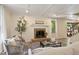 Cozy living room features a brick fireplace and large windows with natural light at 224 Heidinger Dr, Cary, NC 27511