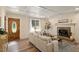 Inviting living room with fireplace, hardwood floors, and abundant natural light at 224 Heidinger Dr, Cary, NC 27511
