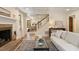 Open-concept living room with hardwood floors, fireplace, and staircase at 224 Heidinger Dr, Cary, NC 27511