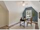 Cozy home office featuring a writing desk, wood floors, and a window for natural light at 224 Heidinger Dr, Cary, NC 27511