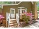Side view of a home featuring an outdoor entry and blooming pink azaleas at 224 Heidinger Dr, Cary, NC 27511
