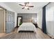 Bedroom with a ceiling fan, gray paneled wall, and decor at 226 Smith Dr, Durham, NC 27712