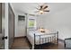 This charming bedroom features a black metal bed frame, wood floors and a window at 226 Smith Dr, Durham, NC 27712