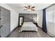 Bedroom with a ceiling fan, gray paneled wall, and decor at 226 Smith Dr, Durham, NC 27712