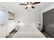This is a bright bedroom that features a ceiling fan, wood floors, and custom moulding at 226 Smith Dr, Durham, NC 27712